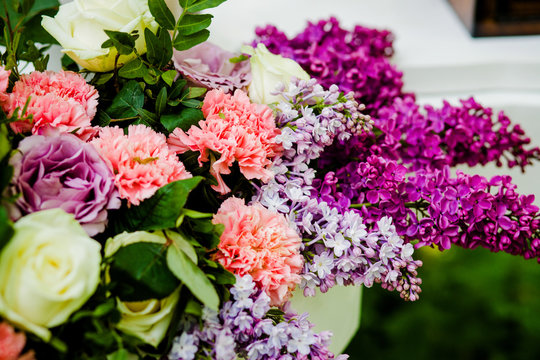 Sweet bouquet lilac flowers standing on the table