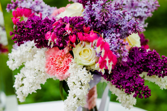 Bouquet lilac flowers standing on the table