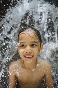 Boy at waterfall