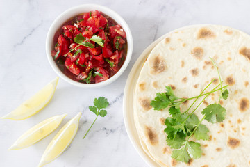 Homemade vegetarian tasty meal of tortillas, salsa and chickpeas.