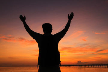 Silhouette of a man  in the beautiful sunrise.