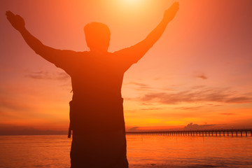 Fototapeta premium Silhouette of a man in the beautiful sunrise.
