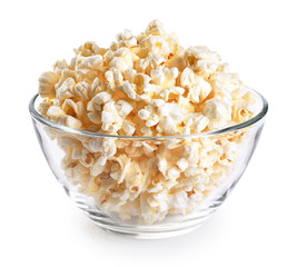 Popcorn in a glass bowl isolated on a white background.