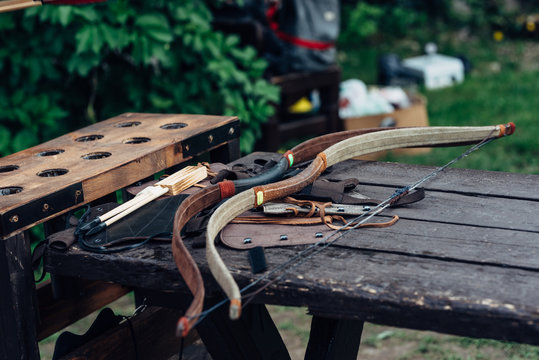 Bow and arrows on a table