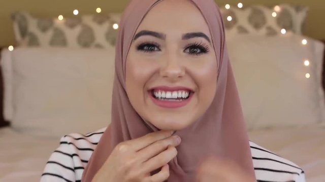 beautiful muslim girl front the camera, modern muslim woman