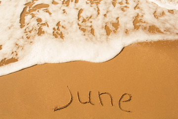 The inscription on the sand is June.