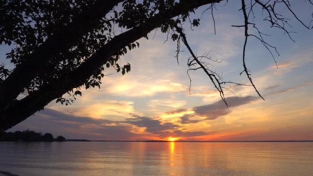 Sunset over water in Willow Beach Park, Lake Simcoe, Georgina, Ontario, Canada