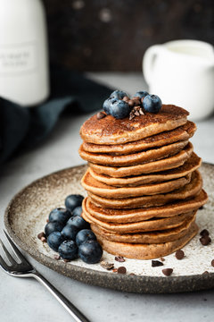 Pancakes with buckwheat and oat flour. Healthy vegan pancakes. Chocolate pancakes