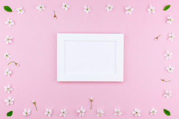 Blank frame mockup with white flowers