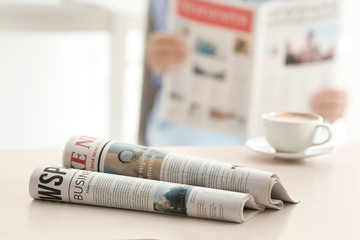 Morning newspapers on white table