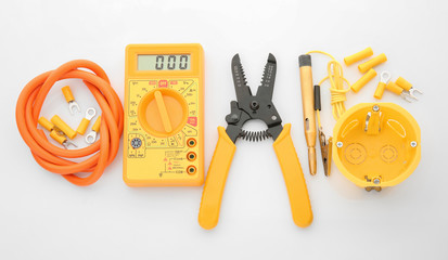 Electrician's supplies on white background