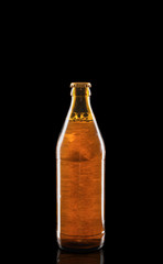 Bottle of beer on dark background