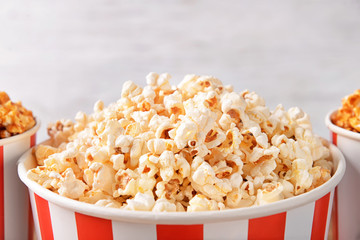Cup with tasty popcorn, closeup