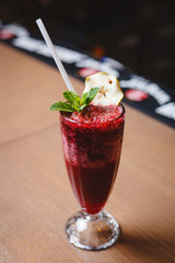 Smoothies of black currant in a glass