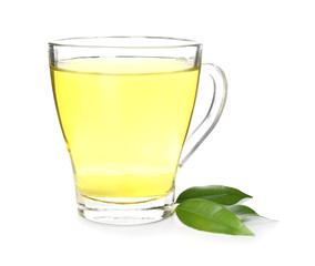 Glass cup with delicious green tea on white background