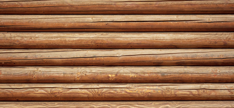 Logs on the wall with a log frame as a background