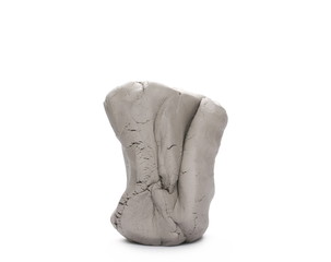 Grey modelling clay lump, shape isolated on white background