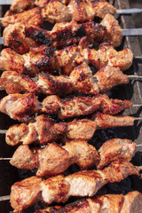 The meat is fried on sticks on charcoal