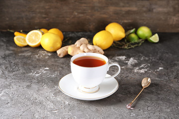 Cup of hot aromatic tea on textured table