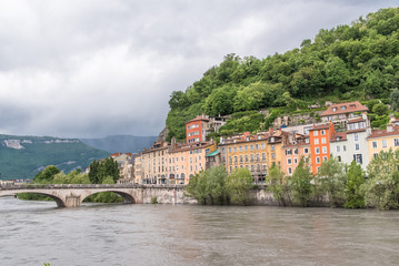 Fototapeta na wymiar Grenoble, panorama of beautiful typical houses on the river Isere, in the center 