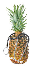 Pineapple with stethoscope on white background. Healthy food concept