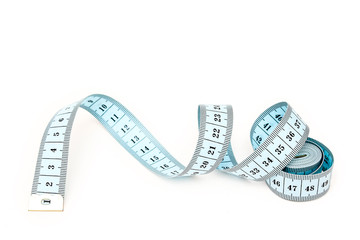 Blue spiral measuring tape isolated on white background.