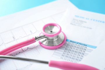Stethoscope with medical documents, closeup. Health care concept