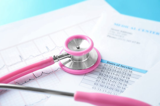 Stethoscope with medical documents, closeup. Health care concept