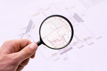 Magnifier glass and paper part of architectural project