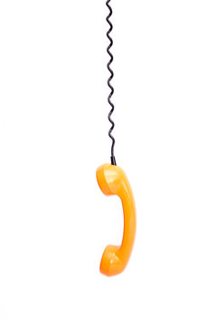 Orange retro telephone tube isolated on white background.