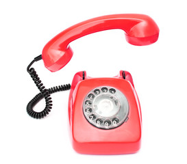 Red retro telephone isolated on white background