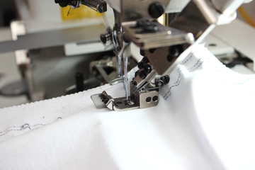 Sewing Process - Women's hands behind her sewing