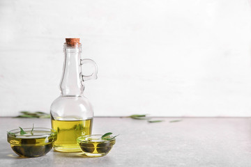 Glassware with oil and canned olives on table