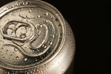 Aluminum can of cold beer on dark background, closeup