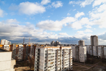 Fototapeta premium Quarter apartment buildings in background of cloudy sky