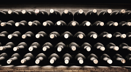 Fototapeta na wymiar Stacked up wine bottles