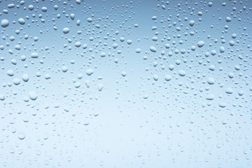 Macro photo of water drops on blue background