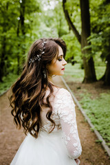 Portrait of a charming bride with wavy hair