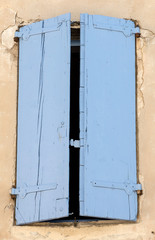 Old  stone house with  wooden shutters, Provence, France.