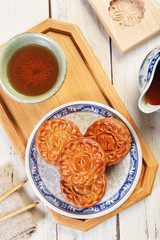 White lotus seed paste mooncake with egg yolk on the plate    