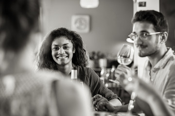 Multi-ethnic group of friends having fun while sharing a meal 