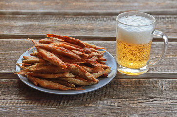 fried smelt and a mug of beer
