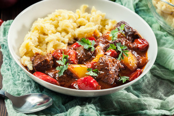 Hungarian beef goulash serwed with galuska noodles