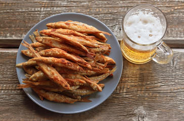 fried smelt and a mug of beer