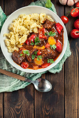 Hungarian beef goulash serwed with galuska noodles