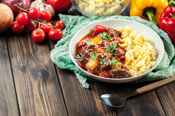 Hungarian beef goulash serwed with galuska noodles