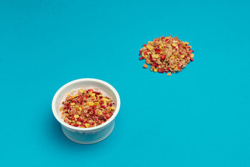 desserts yogurt and cereals, strawberry and raspberry. On blue background