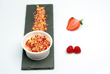 desserts yogurt and cereals, strawberry and raspberry. On white background