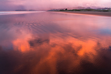 Purple sunset over New Brighton beach on rainy day