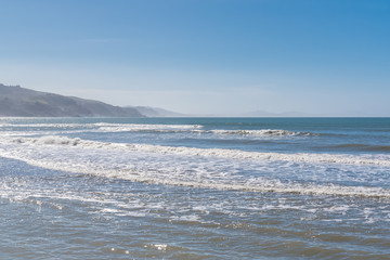 California, view of the Pacific ocean coast, beautiful cliffs in background
